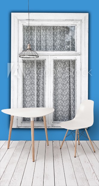 Picture of Old white paint wooden window isolated on blue